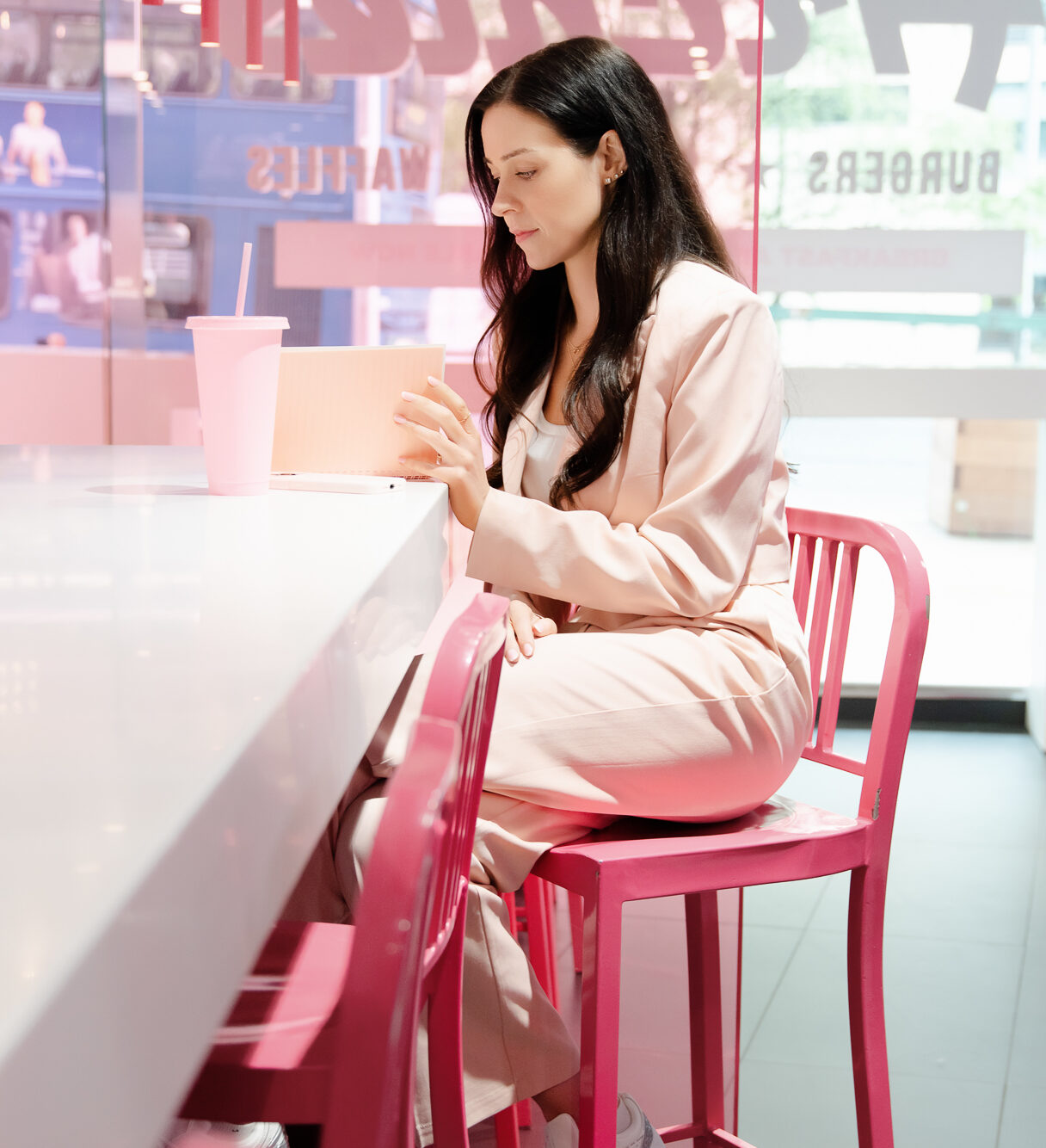 Natalie looking ready for Business in a Pink Shop, wearing a Pink power suit
